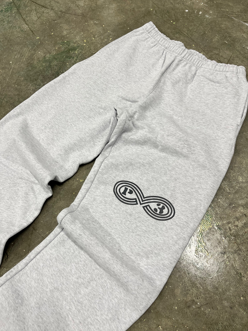 grey sweatpant on concrete floor